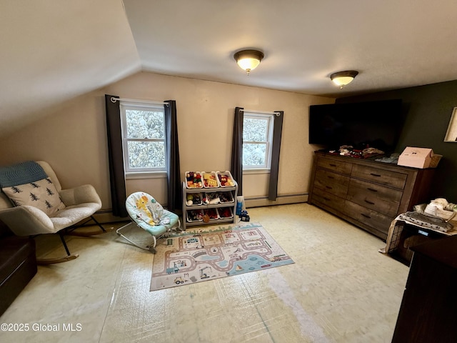 bedroom featuring a baseboard radiator and lofted ceiling