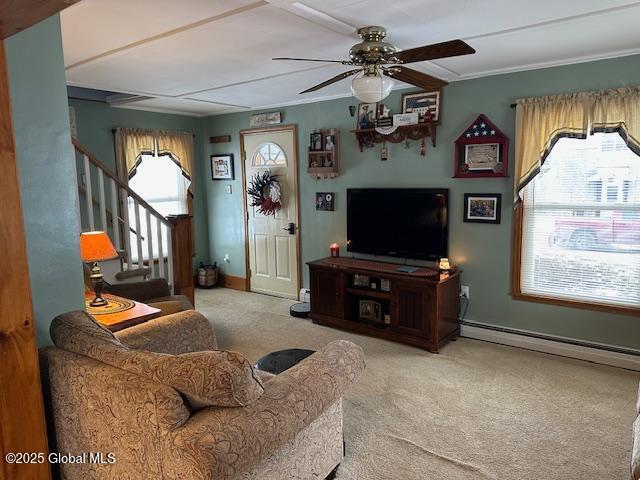 living room featuring carpet flooring, ceiling fan, and baseboard heating