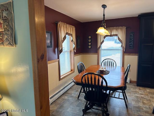 dining space with a baseboard radiator