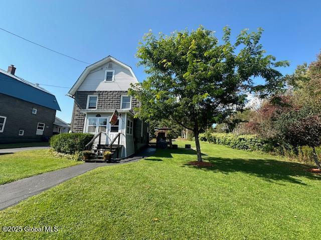 view of front of property with a front lawn