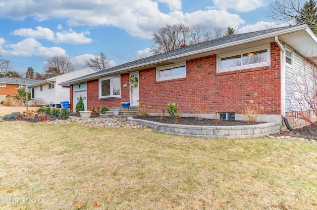 ranch-style home with a front yard and a garage