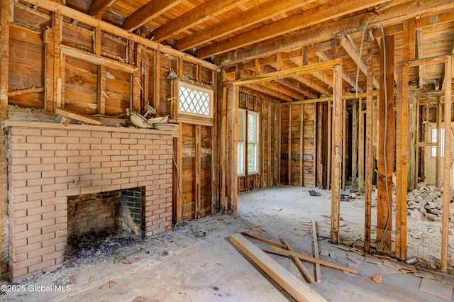 miscellaneous room with a brick fireplace