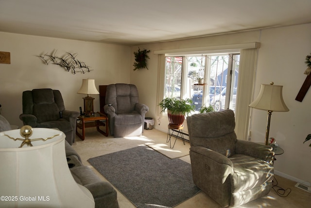 carpeted living room with a baseboard heating unit