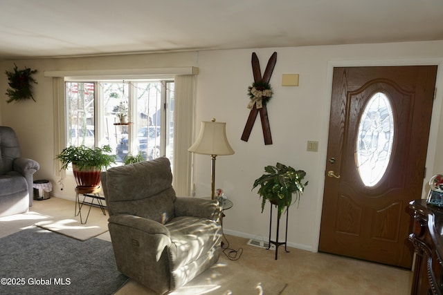 view of carpeted entrance foyer