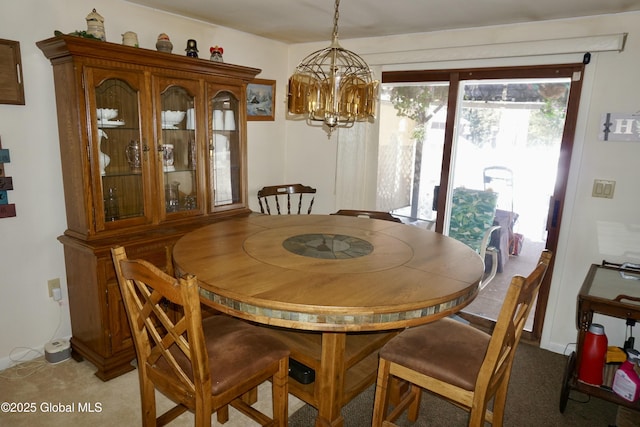 dining space featuring an inviting chandelier