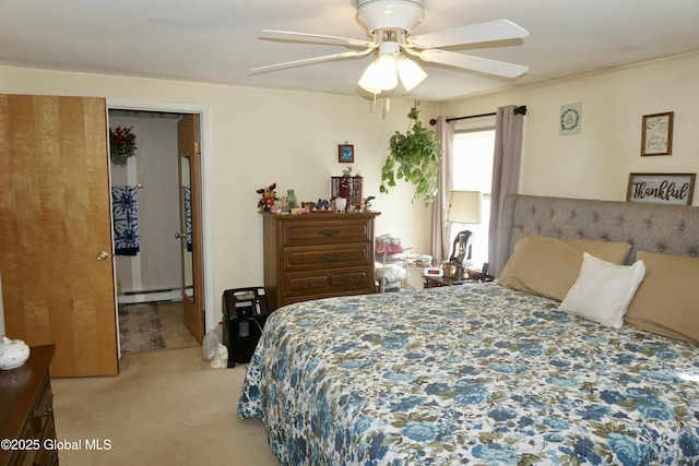 carpeted bedroom with ceiling fan and baseboard heating