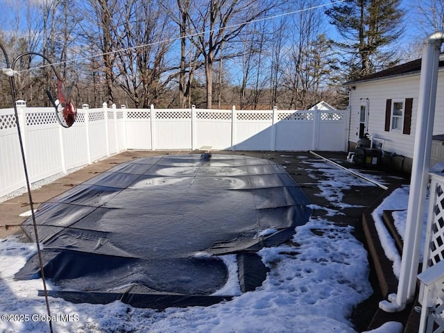 view of snow covered pool