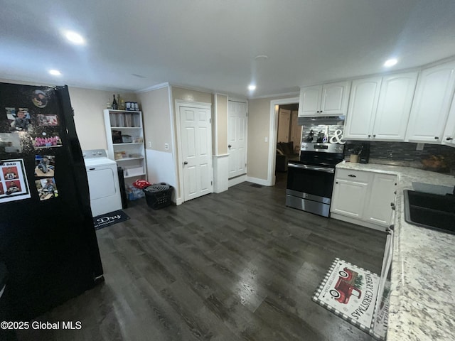 kitchen featuring sink, white cabinetry, black refrigerator, electric range, and washer / dryer