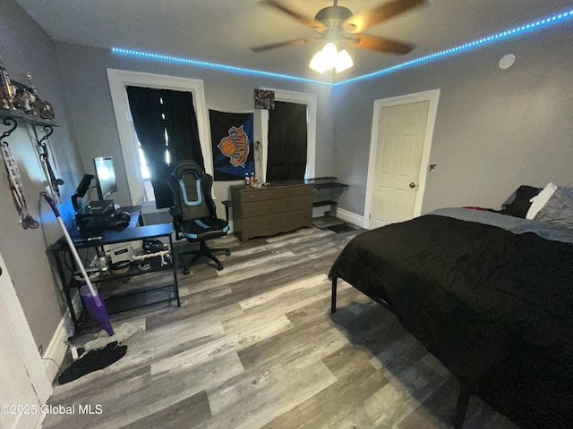 bedroom featuring ceiling fan and light wood-type flooring