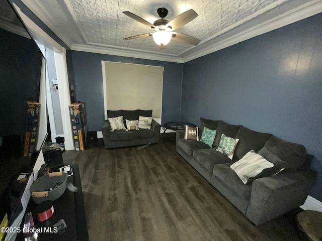 living room featuring ceiling fan, ornamental molding, and wood-type flooring