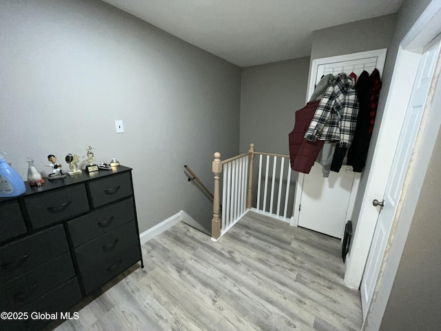 stairs with wood-type flooring