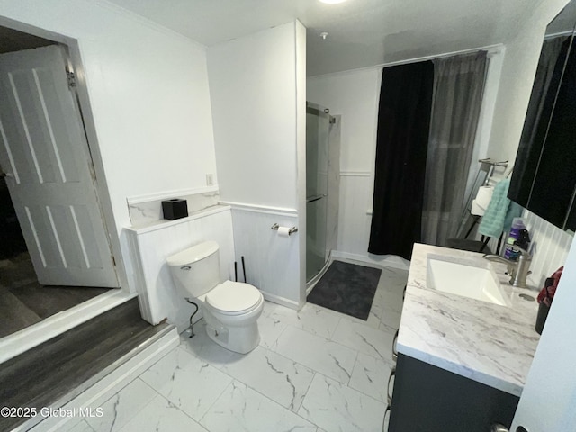 bathroom featuring crown molding, vanity, and toilet