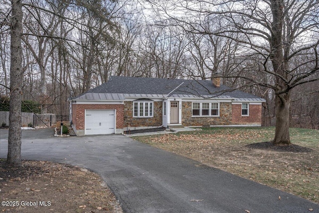 ranch-style house featuring a garage