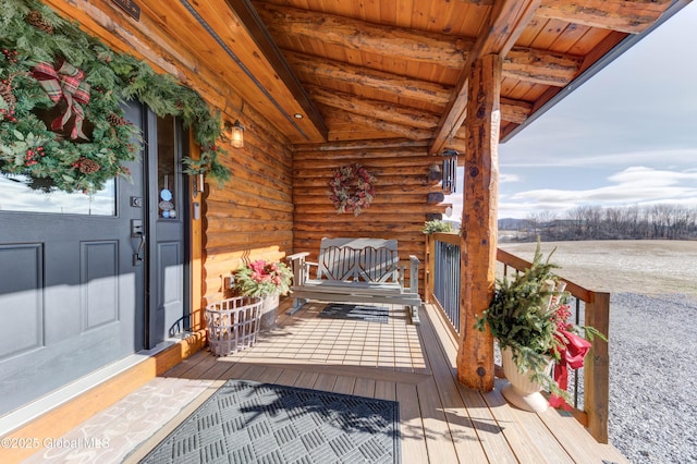 wooden deck featuring covered porch