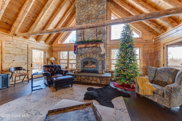 living room featuring hardwood / wood-style flooring, beam ceiling, wood ceiling, and high vaulted ceiling