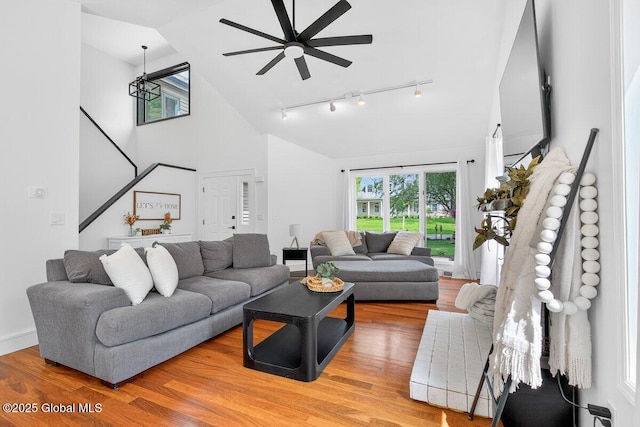 35 Sherwood Trl, Saratoga Springs, Outside, NY 12866 - living room featuring track lighting, ceiling fan, healthy amount of natural light, light wood-style flooring, and high vaulted ceiling