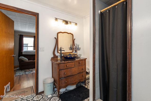 bathroom with wood-type flooring, vanity, and a shower with shower curtain