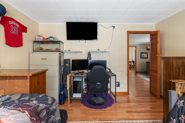 interior space with hardwood / wood-style floors and ornamental molding