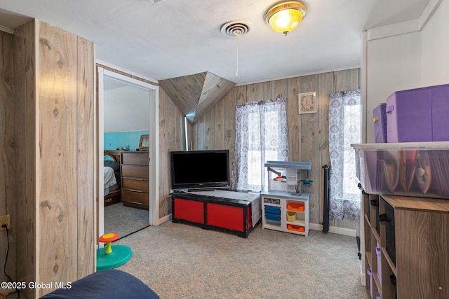 game room with wooden walls and carpet