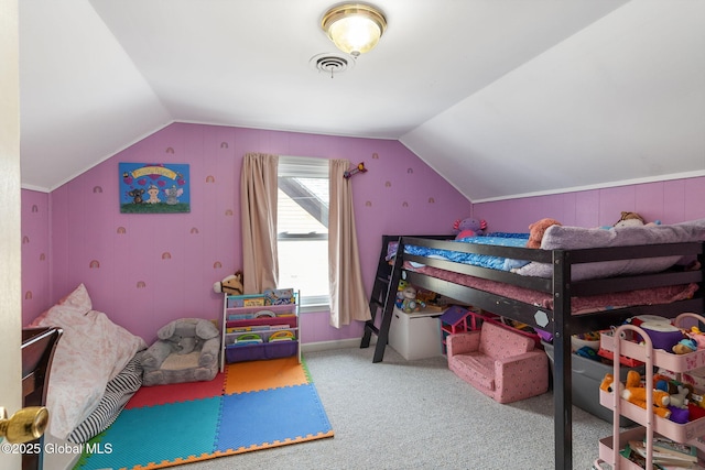 bedroom with lofted ceiling and carpet floors