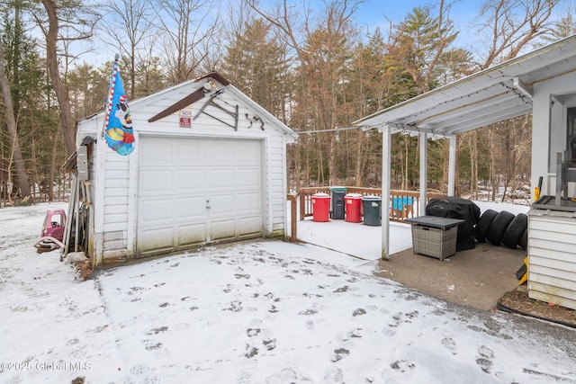 view of snow covered garage