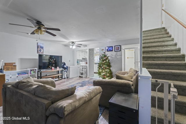 living room featuring hardwood / wood-style floors and ceiling fan