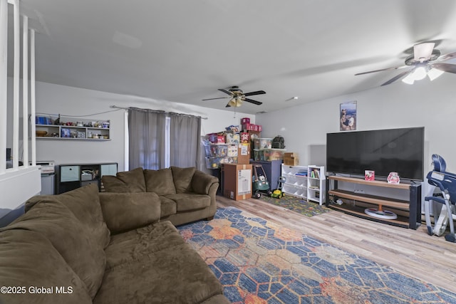 living room with hardwood / wood-style flooring and ceiling fan