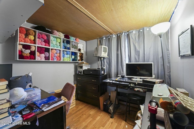 office featuring light hardwood / wood-style floors and wood ceiling