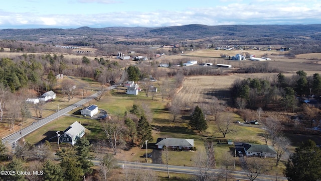 birds eye view of property featuring a mountain view and a rural view