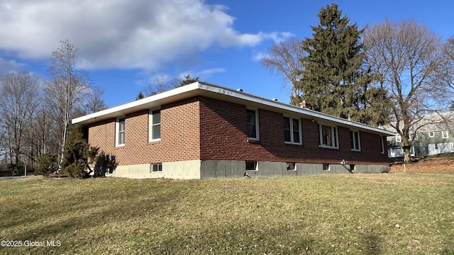 view of home's exterior featuring a lawn