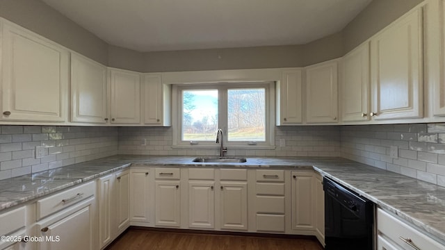 kitchen with backsplash, dishwasher, white cabinetry, and sink