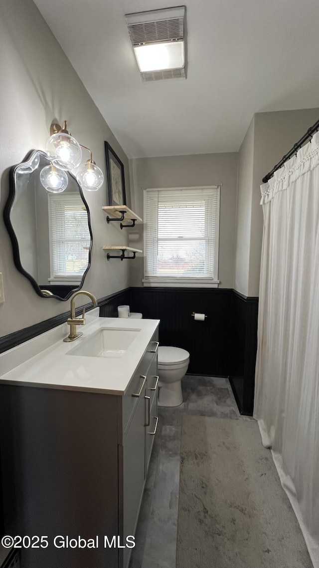 bathroom with vanity and toilet