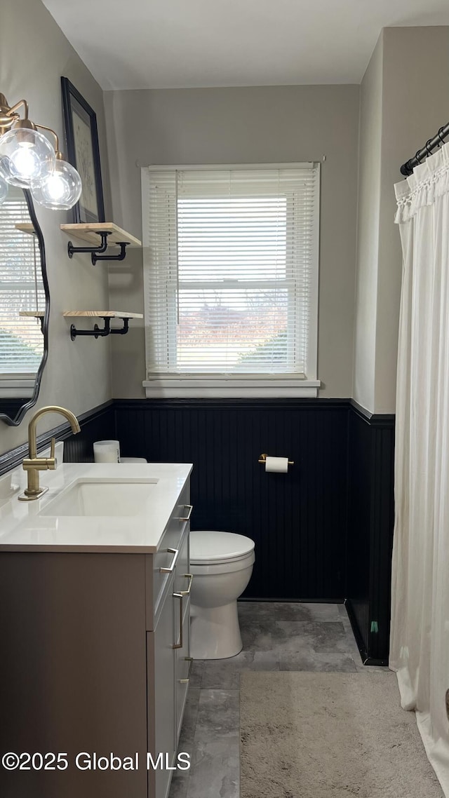 bathroom with vanity and toilet