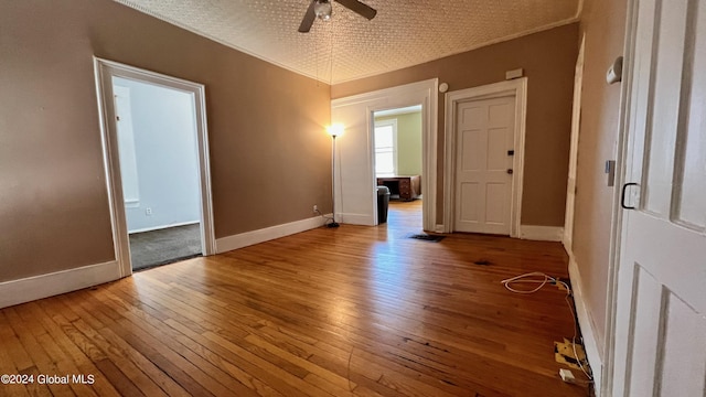 unfurnished room featuring light wood-type flooring and ceiling fan