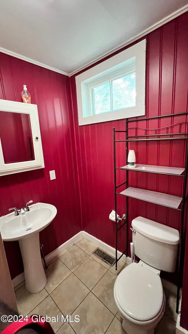 bathroom featuring tile patterned flooring and toilet