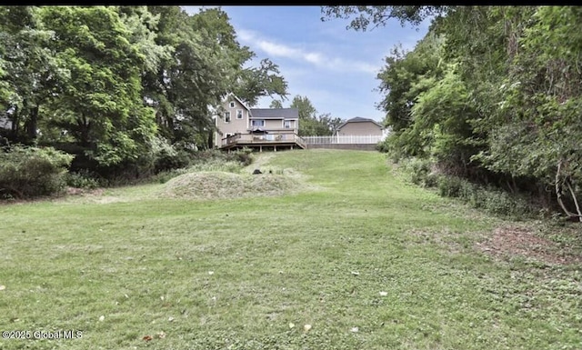 view of yard featuring a wooden deck