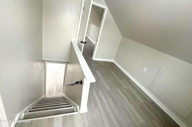 staircase featuring hardwood / wood-style flooring