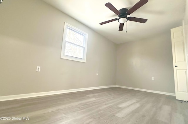 spare room with ceiling fan and light hardwood / wood-style floors