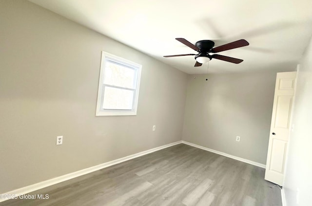 empty room with wood-type flooring and ceiling fan