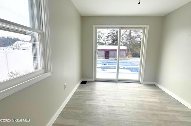 unfurnished room featuring light hardwood / wood-style flooring