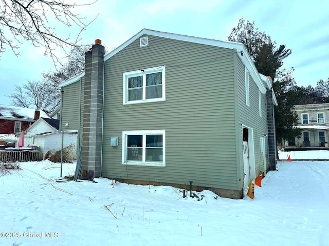 view of snow covered house