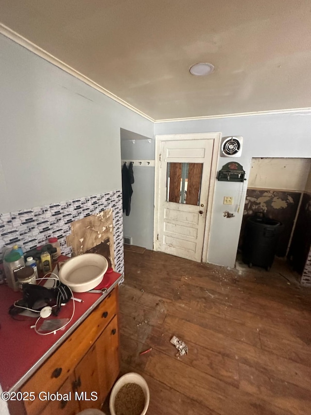 bathroom featuring hardwood / wood-style floors and ornamental molding