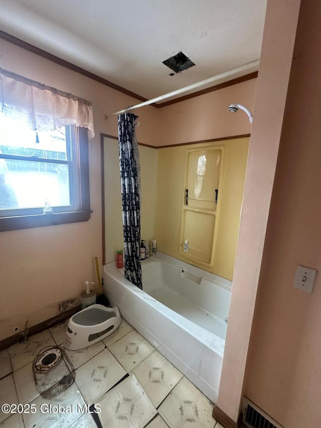 bathroom featuring shower / bathtub combination with curtain