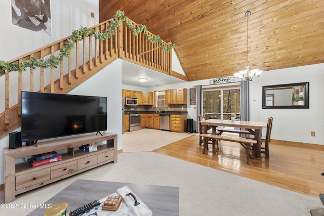 living room featuring wooden ceiling, high vaulted ceiling, and a chandelier