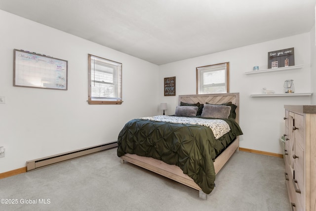 bedroom featuring light carpet and a baseboard radiator