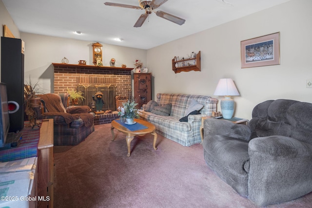 living room featuring carpet, a fireplace, and ceiling fan