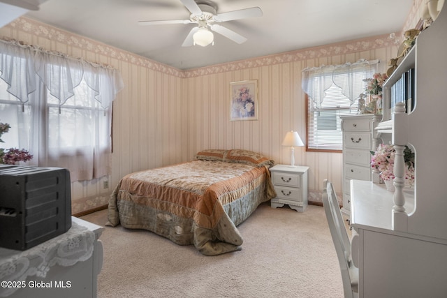 bedroom with light carpet and ceiling fan