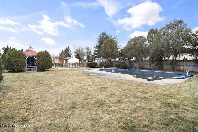 view of yard with a gazebo and a covered pool