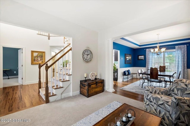 living room with a chandelier and carpet