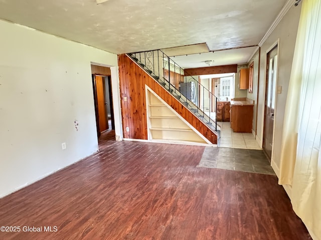 interior space featuring hardwood / wood-style flooring and ornamental molding